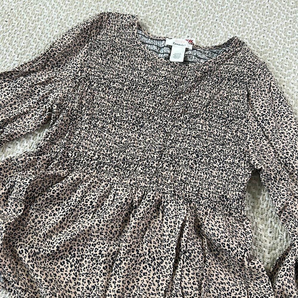 Cheetah peplum top NEW WITH TAGS size small